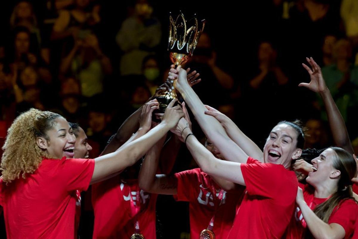 Team USA celebrate with the trophy after the 2022 FIBA Women's Basketball World Cup final match between China and the USA at the Superdome on October 1, 2022, in Sydney.   Andy Cheung / AFP