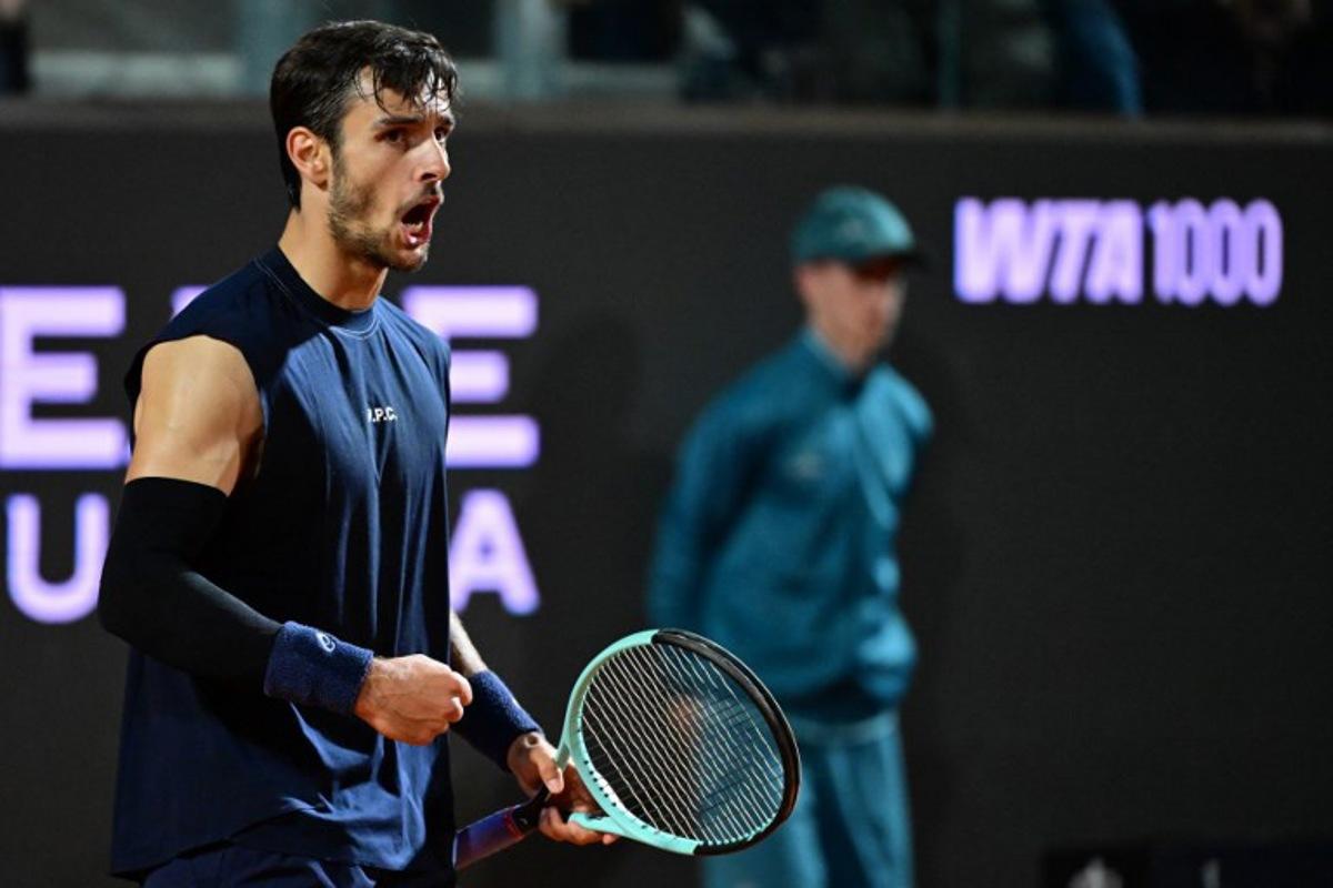 Italy's Lorenzo Musetti reacts during the men's singles quarter-final match against Germany's Alexander Zverev at the ATP Rome Open tennis tournament at Foro Italico in Rome on May 14, 2025.  PIERO CRUCIATTI / AFP