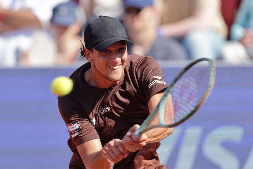Italy's Luciano Darderi returns the ball to Argentina's Francisco Cerundolo (not pictured) during the men's singles semi-final match of the ATP Nordea Open tennis tournament in Bastad, Sweden, on July 19, 2025.  Bjorn LARSSON ROSVALL / TT News Agency / AFP