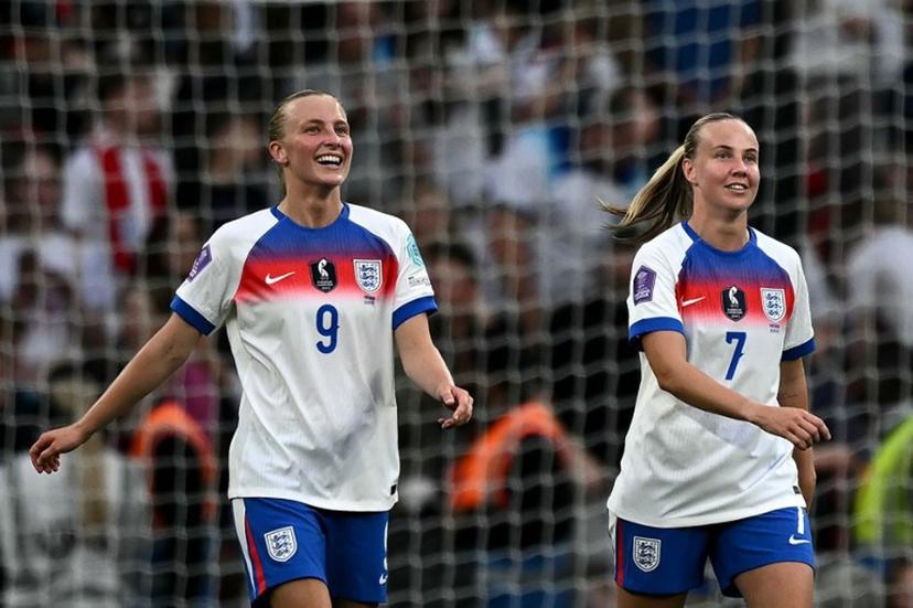 England's striker#07 Beth Mead (R) celebrates scoring the team's fourth goal with England's striker #09 Aggie Beever-Jones during the UEFA Women's Nations League Group A3 football match between England and Portugal at Wembley Stadium in London on May 30, 2025.   Ben STANSALL / AFP