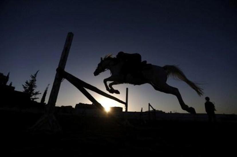 A Yemeni boy competes in the National Horse Jumping Championships in Sanaa on January 9, 2017. 
Mohammed HUWAIS / AFP