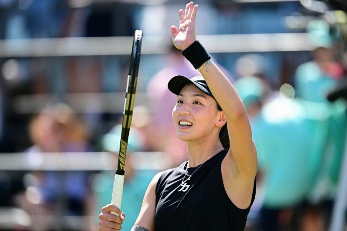 China's Wang Xinyu celebrates winning the semi-final match at the WTA tennis tournament in Berlin on June 21, 2025.  Tobias SCHWARZ / AFP