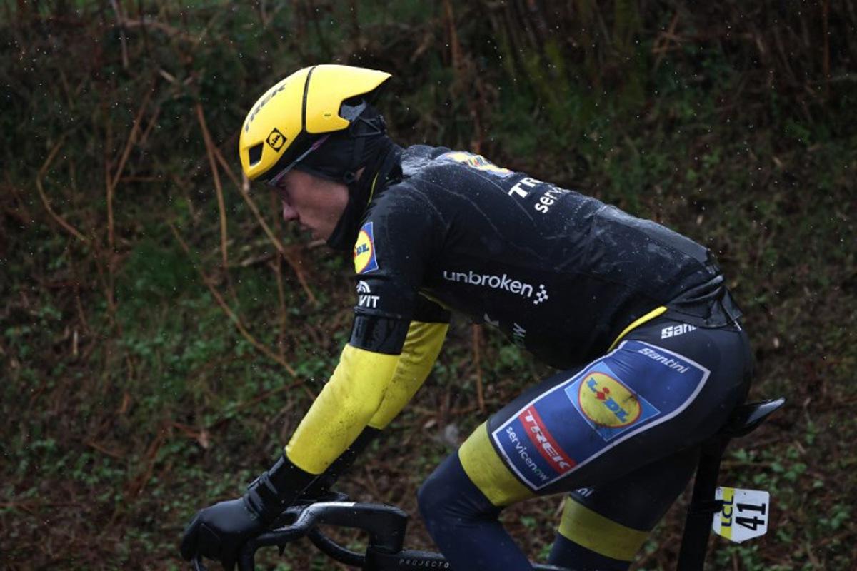 Lidl - Trek's Spanish rider Juan Ayuso, wearing the overall leader yellow jersey, cycles with the leading pack during the 4th stage of the Paris-Nice cycling race, 195 km between Bourges and Uchon, on March 11, 2026.  Anne-Christine POUJOULAT / AFP