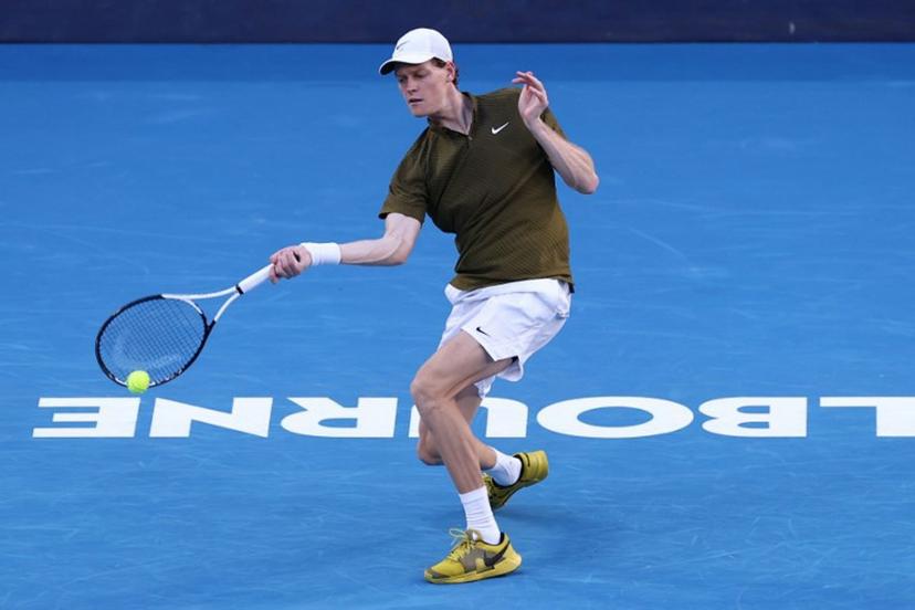 Italy's Jannik Sinner hits a shot against Italy's Luciano Darderi during their men's singles match on day nine of the Australian Open tennis tournament in Melbourne on January 26, 2026.  IZHAR KHAN / AFP
