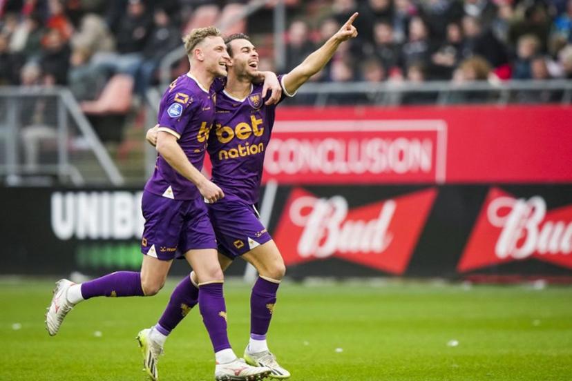 Go Ahead Eagles' Joris Kramer (L) and Enric Llansana celebrate the 0-1 during the Dutch Eredivisie football match between PSV Eindhoven and Go Ahead Eagles at Galgenwaard stadium in Utrecht on December 15, 2024.  Tobias Kleuver / ANP / AFP