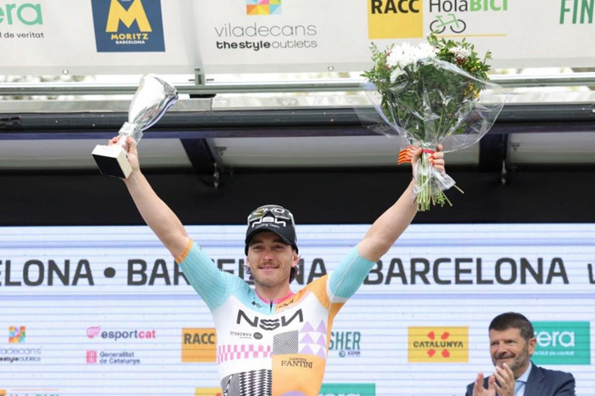Team NSN Cycling Team's Australian rider Brady Gilmore celebrates on the podium winning the seventh and last stage of the 2026 'Volta a Catalunya' cycling tour of Catalonia, a 95,1 km race between Barcelona and Barcelona, on March 29, 2026.  Josep LAGO / AFP