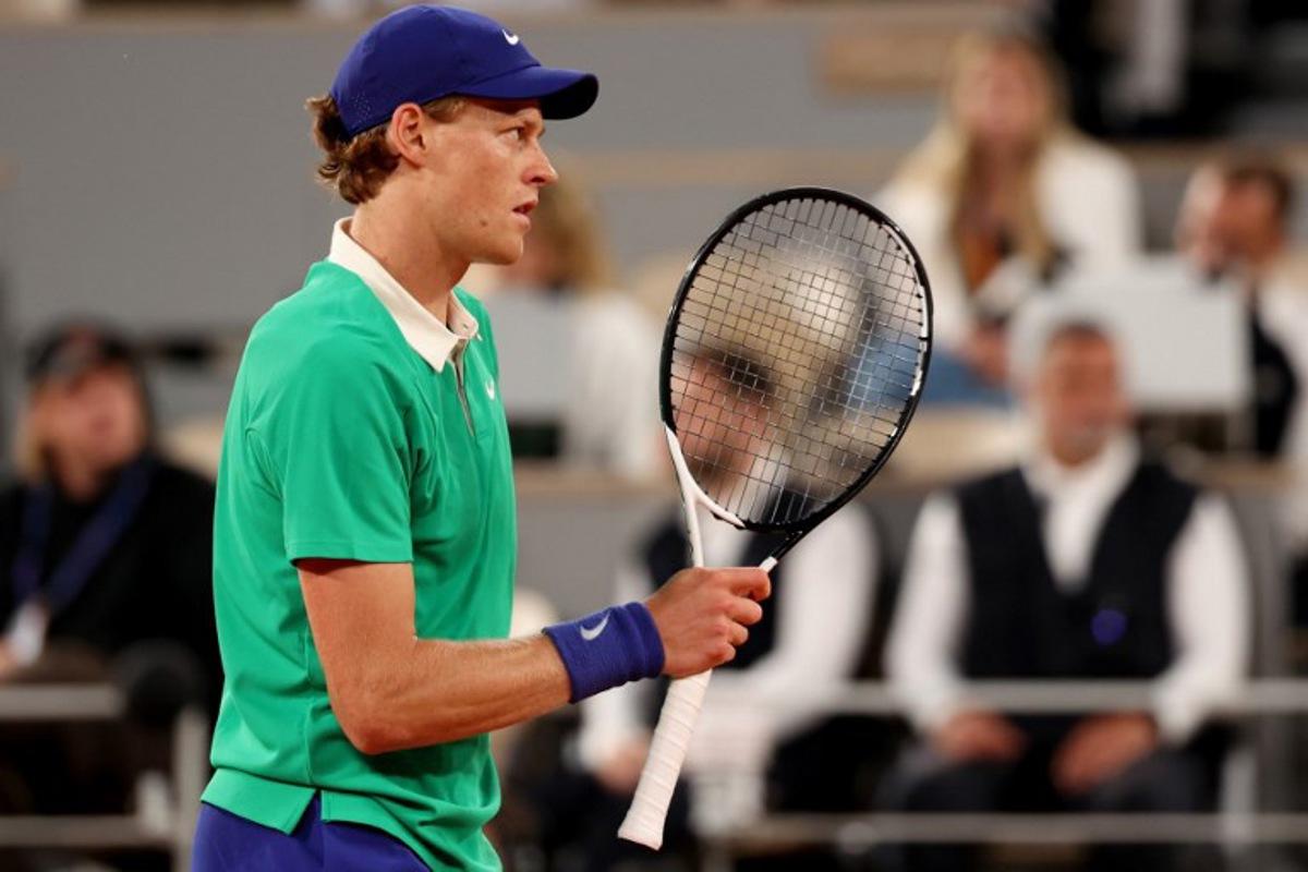 Italy's Jannik Sinner reacts during his men's singles match against Russia's Andrey Rublev on day 9 of the French Open tennis tournament on Court Philippe-Chatrier at the Roland-Garros Complex in Paris on June 2, 2025.  ALAIN JOCARD / AFP