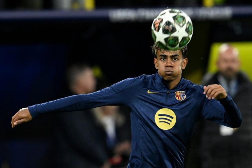 Barcelona's Spanish forward #19 Lamine Yamal warms up on the ball prior to the UEFA Champions League quarter-final second leg football match between BVB Borussia Dortmund and FC Barcelona in Dortmund, western Germany on April 15, 2025.  INA FASSBENDER / AFP
