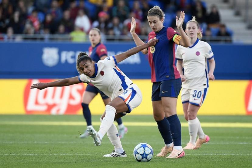 Chelsea's US forward #09 Catarina Macario (L) vies for the ball with Barcelona's Spanish midfielder #11 Alexia Putellas during the UEFA Women's Champions League semi-final first leg football match between FC Barcelona and Chelsea at the Johan Cruyff stadium in Barcelona, on April 20, 2025.  Josep LAGO / AFP