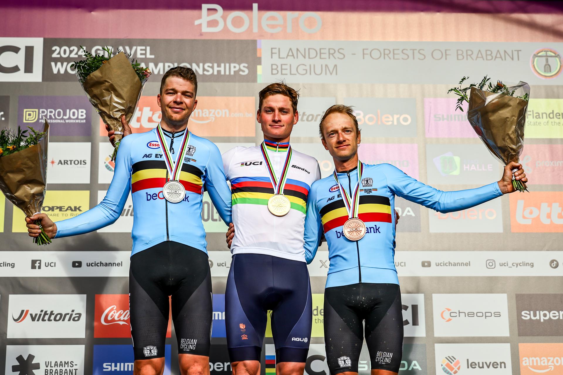 Belgian Florian Vermeersch of Lotto Dstny, Dutch Mathieu van der Poel of Alpecin-Deceuninck and Belgian Quinten Hermans of Alpecin-Deceuninck celebrates on the podium after the men elite race at the UCI World Gravel Championships, Sunday 06 October 2024, in Leuven. BELGA PHOTO DAVID PINTENS