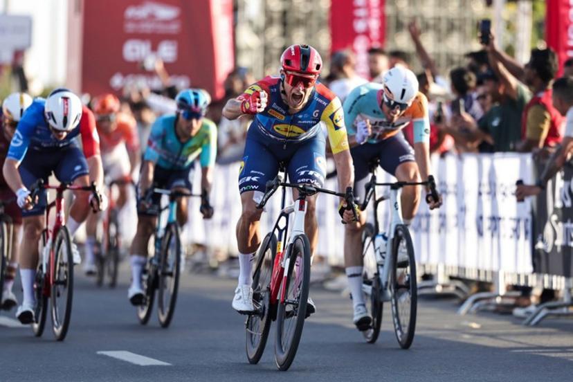 Lidl-Trek's Italian rider Jonathan Milan reacts after crossing the finish line first during the fourth stage of the UAE Tour cycling event in al-Fujairah on February 19, 2026.  Fadel SENNA / AFP