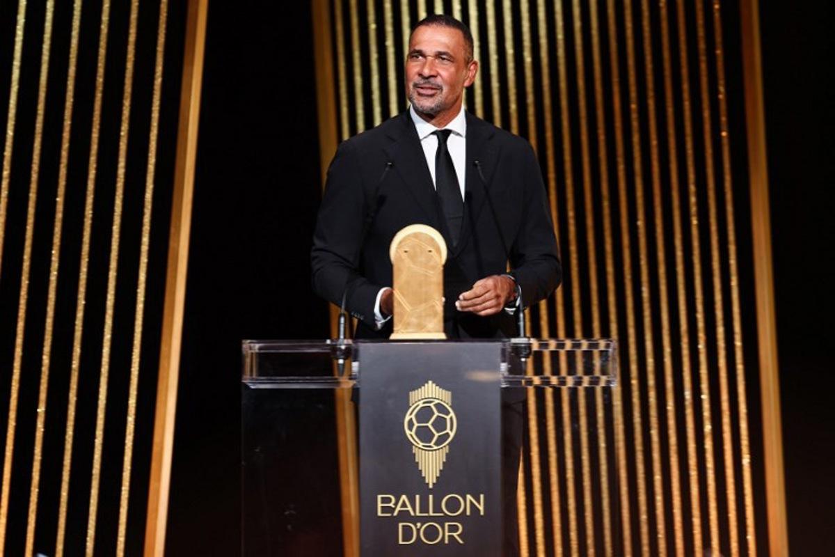Former Dutch football player Ruud Gullit speaks on stage to give the Kopa Trophy for best under-21 player during the 2024 Ballon d'Or France Football award ceremony at the Theatre du Chatelet in Paris on October 28, 2024.  FRANCK FIFE / AFP