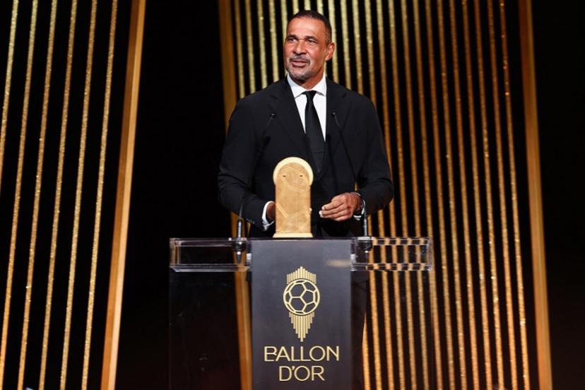 Former Dutch football player Ruud Gullit speaks on stage to give the Kopa Trophy for best under-21 player during the 2024 Ballon d'Or France Football award ceremony at the Theatre du Chatelet in Paris on October 28, 2024.  FRANCK FIFE / AFP