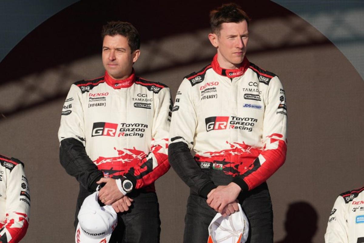 Winner British driver Elfyn Evans (R) and his co-driver Scott Martin pose on the podium after the final stage of Rally Sweden, the second round of the FIA World Rally Championship in Umea, Sweden, on February 15, 2026.   Peo MOLLER / TT News Agency / AFP