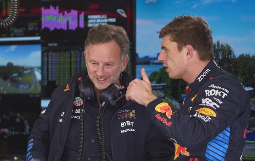 Red Bull Racing's Dutch driver Max Verstappen (R) speaks with Red Bull Racing's British team principal and CEO Christian Horner before the start of the first practice session for the 2024 Canada Formula One Grand Prix at Circuit Gilles-Villeneuve in Montreal, Canada, on June 7, 2024.   Geoff Robins / AFP