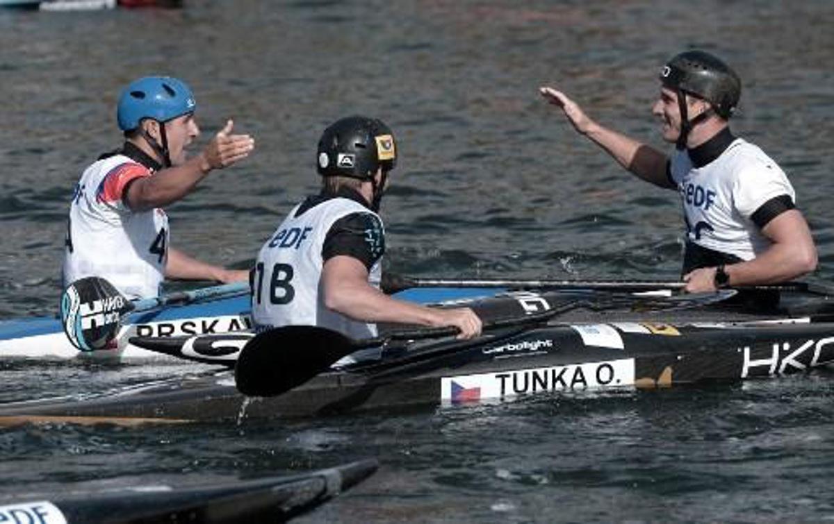 Czech Republic's (from L ) Jiri Prskavec, Tunka Ondrej and Prindis Vit react after they won the Kayak Men Teams final in the Kayak Men Team final at the 2017 ICF Canoe Slalom and Wildwater Canoeing World Championships in Pau, southern France, on September 26, 2017.   IROZ GAIZKA / AFP