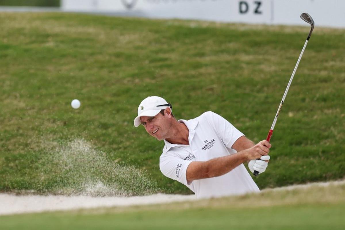 Nicolas Colsaerts of Belgium hits a shot from a bunker during the China Open golf tournament in Shanghai on April 17, 2025.  STR / AFP