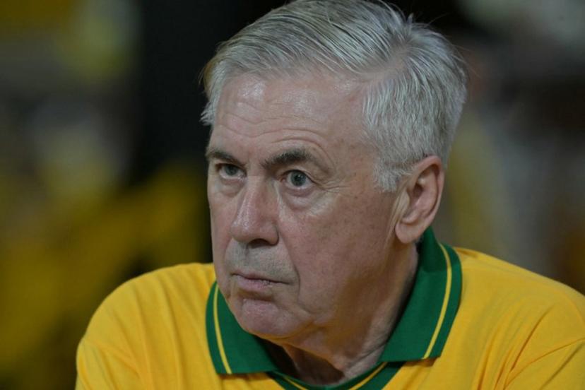 Brazil's Italian head coach Carlo Ancelotti gestures while attending the second night of carnival parade in the Sambadrome in Sao Paulo, Brazil, on February 14, 2026.  NELSON ALMEIDA / AFP
