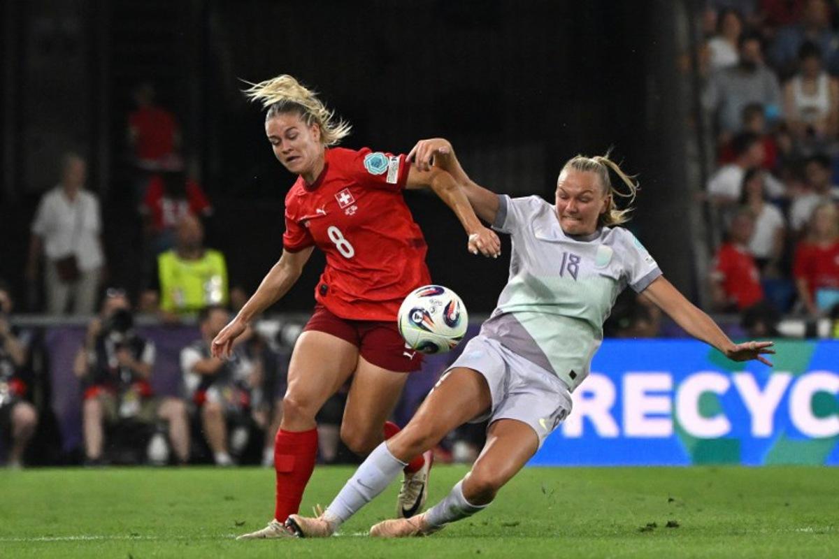 Switzerland's defender #08 Nadine Riesen (L) and Norway's midfielder #18 Frida Maanum fight for the ball during the UEFA Women's Euro 2025 Group A football match between Switzerland and Norway at the St Jakob-Park Stadium in Basel on July 2, 2025.  Miguel MEDINA / AFP