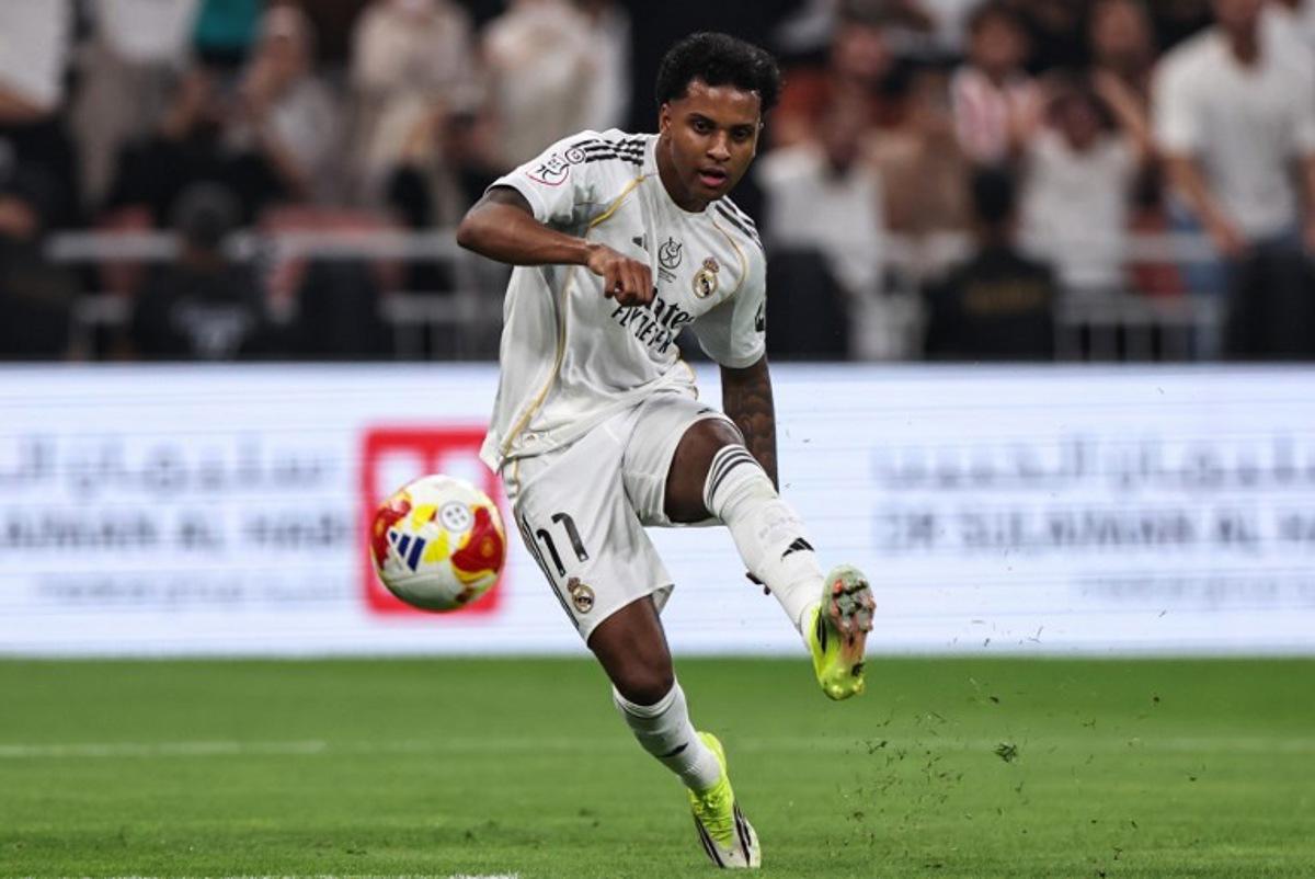 Real Madrid's Brazilian forward #11 Rodrygo kicks the ball during the Spanish Supercup semi-final football match between Atletico Madrid and Real Madrid at King Abdullah Sports City in Jeddah on January 8, 2026.  Fadel SENNA / AFP