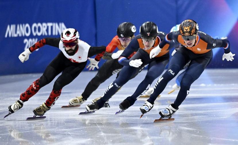Canada's Steven Dubois, China's Liu Shaoang, Netherlands' Teun Boer and Netherlands' Jens van 't Wout compete in the short track speed skating men's 500m semi-final during the Milano Cortina 2026 Winter Olympic Games at Milano Ice Skating Arena in Milan on February 18, 2026.  WANG Zhao / AFP