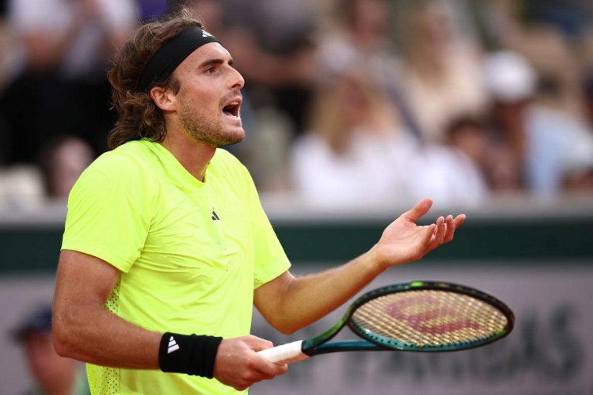 Greece's Stefanos Tsitsipas reacts during his men's singles match against Italy's Matteo Gigante on day 4 of the French Open tennis tournament on Court Simonne-Mathieu at the Roland-Garros Complex in Paris on May 28, 2025.  Anne-Christine POUJOULAT / AFP