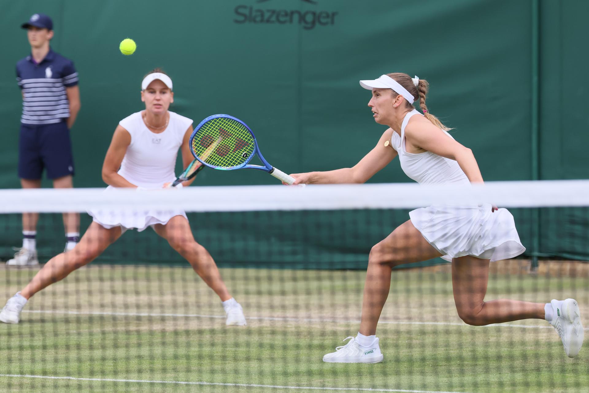 Russian Veronika Kudermetova and Belgian Elise Mertens pictured during a doubles tennis match against Czech-Kazakh pair Bouzkova-Danilina, in the second round of the women's doubles at the 2025 Wimbledon grand slam tournament, Saturday 05 July 2025 at the All England Tennis Club, in South-West London, Britain. BELGA PHOTO BENOIT DOPPAGNE