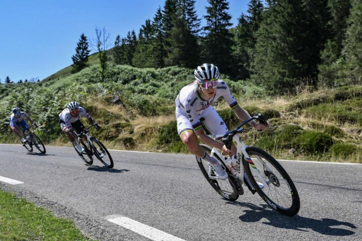 UAE Team Emirate - XRG team's Slovenian rider Tadej Pogacar cycles in the descent of Col du Soulor during the 12th stage of the 112th edition of the Tour de France cycling race, 180.6 km between Auch and Hautacam, in the Pyrenees mountains of southwestern France, on July 17, 2025.  Marco BERTORELLO / AFP