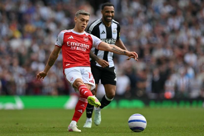Arsenal's Belgian midfielder #19 Leandro Trossard passes the ball during the English Premier League football match between Arsenal and Newcastle United at the Emirates Stadium in London on May 18, 2025.   Glyn KIRK / AFP