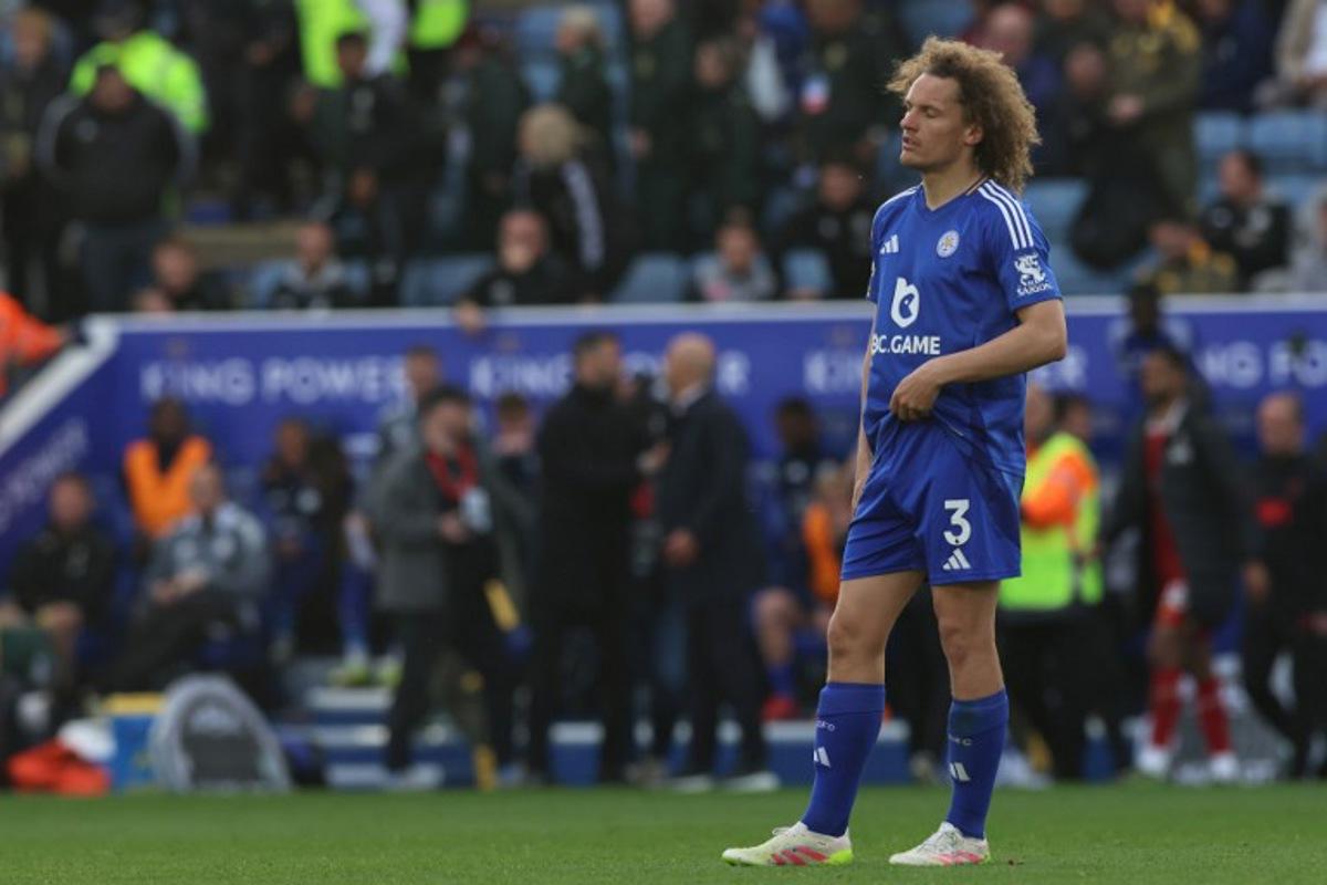 Leicester City's Belgian defender #03 Wout Faes reacts on the pitch after the English Premier League football match between Leicester City and Liverpool at King Power Stadium in Leicester, central England on April 20, 2025. Leicester were relegated from the Premier League after a 1-0 defeat to Liverpool. Darren Staples / AFP