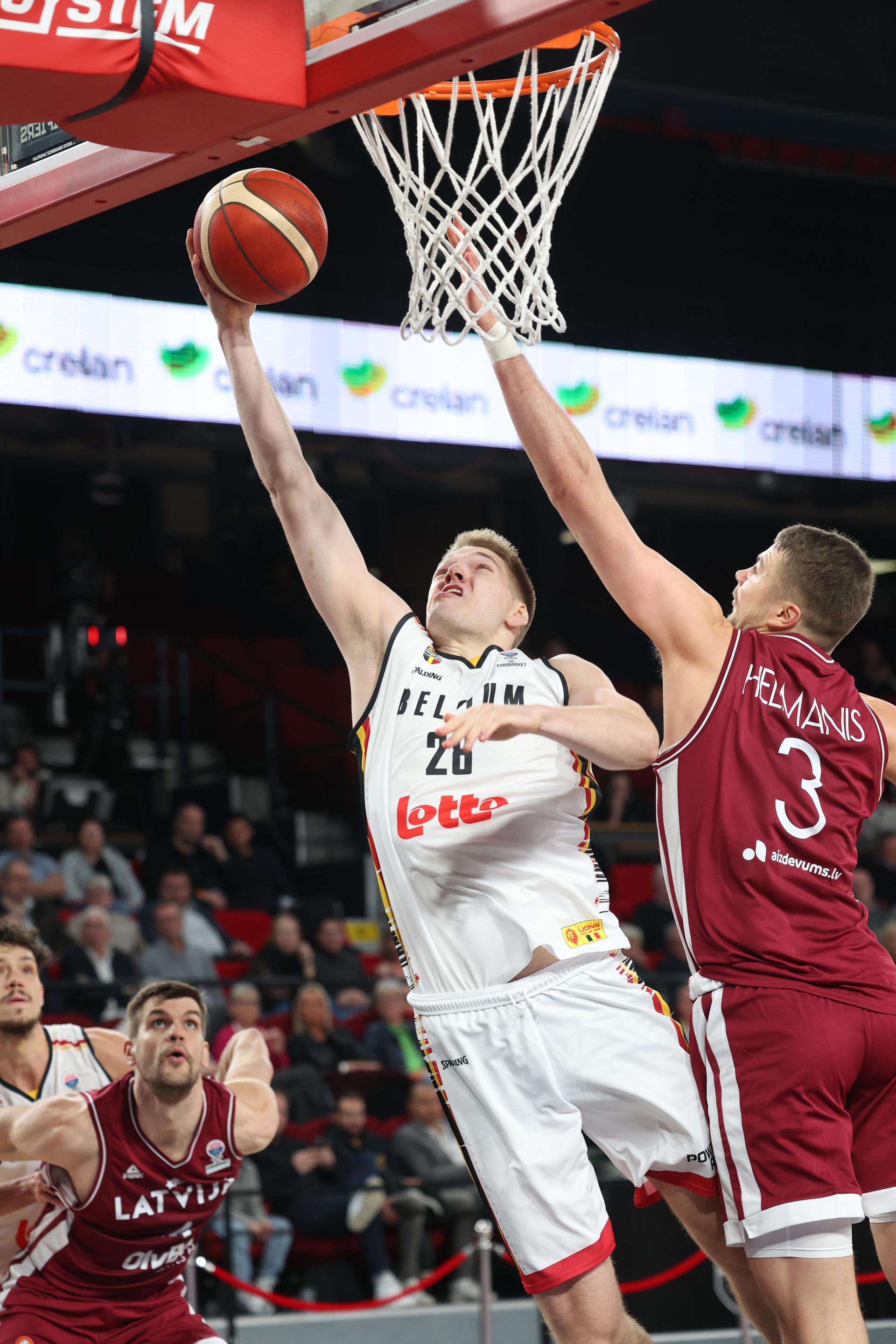 Belgium's Thijs De Ridder and Latvian Kriss Helmanis fight for the ball during a basketball match between Belgium's national team Belgian Lions and Latvia, Monday 25 November 2024 in Charleroi, game 4/6 in the group stage of the qualifications for the Eurobasket 2025 European championships. BELGA PHOTO VIRGINIE LEFOUR