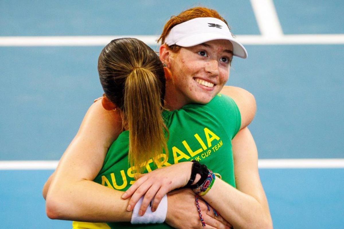 Australia's Maya Joint (R) celebrates with her team after victory against Colombia's Yuliana Monroy during their women's singles match at the Billie Jean King Cup in Brisbane on April 12, 2025.  Patrick HAMILTON / AFP