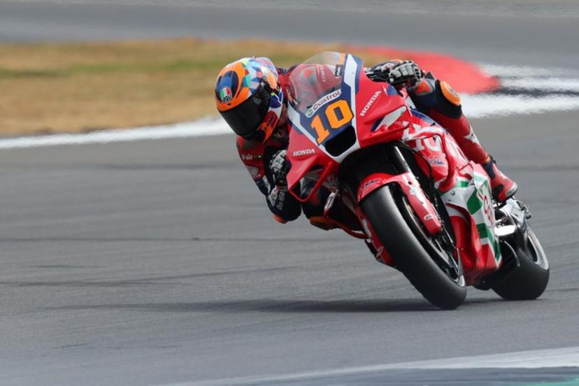 Honda HRC Castrol team's  Italian MotoGP rider Luca Marini takes part in the sprint race of the MotoGP British Grand Prix at Silverstone circuit in Northamptonshire, central England, on May 24, 2025.   Adrian Dennis / AFP