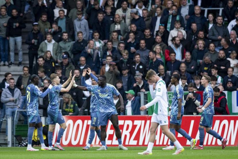 Ajax's Dutch forward #09 Brian Brobbey (C) celebrates with teammates after scoring the opening goal during the Dutch Eredivisie football match between FC Groningen and Ajax Amsterdam at Euroborg Stadium in Groningen on May 14, 2025.  Robin van Lonkhuijsen / ANP / AFP