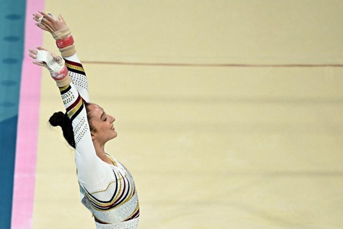 Belgium's Nina Derwael reacts after competing  in the artistic gymnastics women's uneven bars final during the Paris 2024 Olympic Games at the Bercy Arena in Paris, on August 4, 2024.  Gabriel BOUYS / AFP