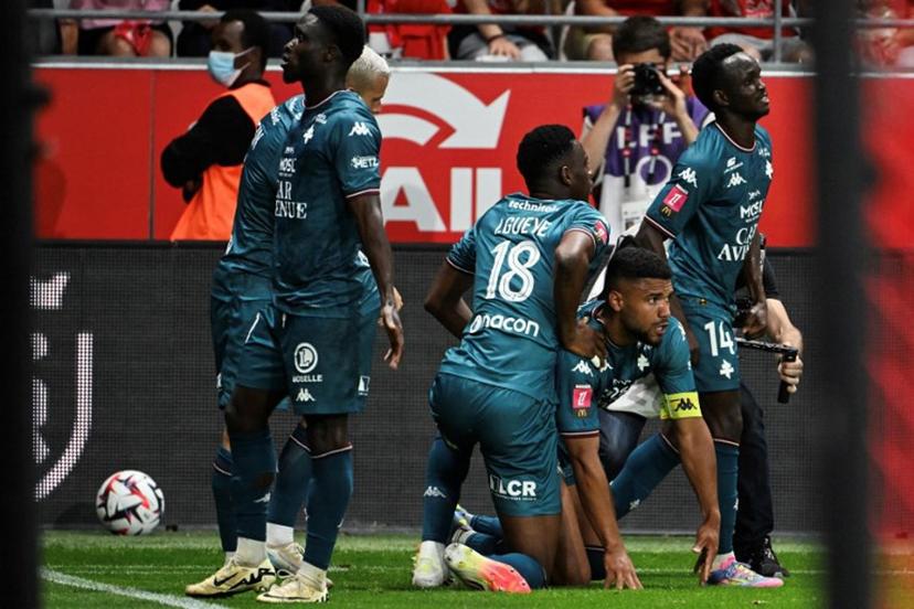 Metz' players celebrate after Metz's French defender #03 Matthieu Udol (2R) scored a goal during the French L1-L2 playoff second leg football match between Stade de Reims and FC Metz at Stade Auguste-Delaune in Reims, northern France on May 29, 2025.  FRANCOIS NASCIMBENI / AFP