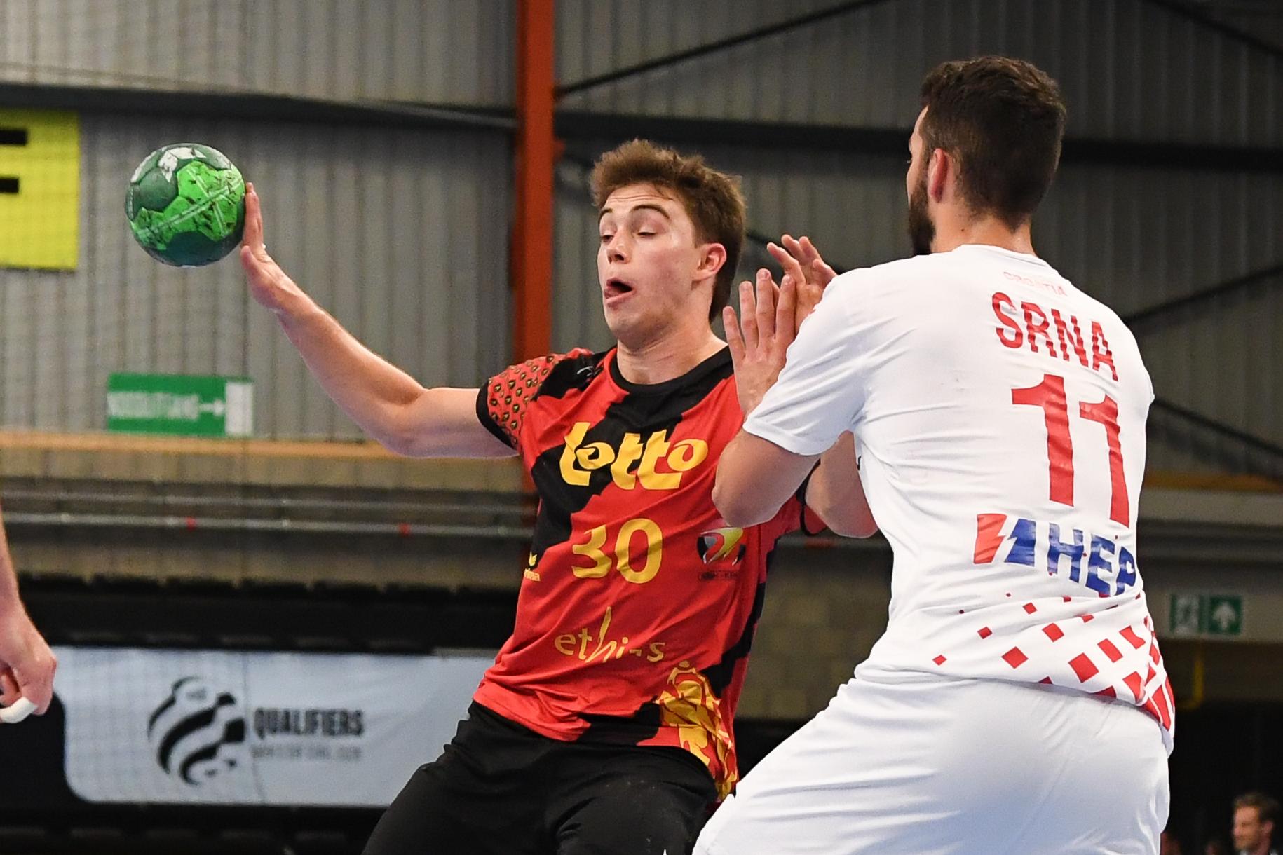 Belgium's Dree Riske and Croatian Zvonimir Srna pictured in action during a handball game between Belgian national team 'Red Wolves' and Croatia, Wednesday 07 May 2025 in Hasselt, game 5/6 in the qualifications for the men's EHF Euro 2026 European Championship. BELGA PHOTO JILL DELSAUX