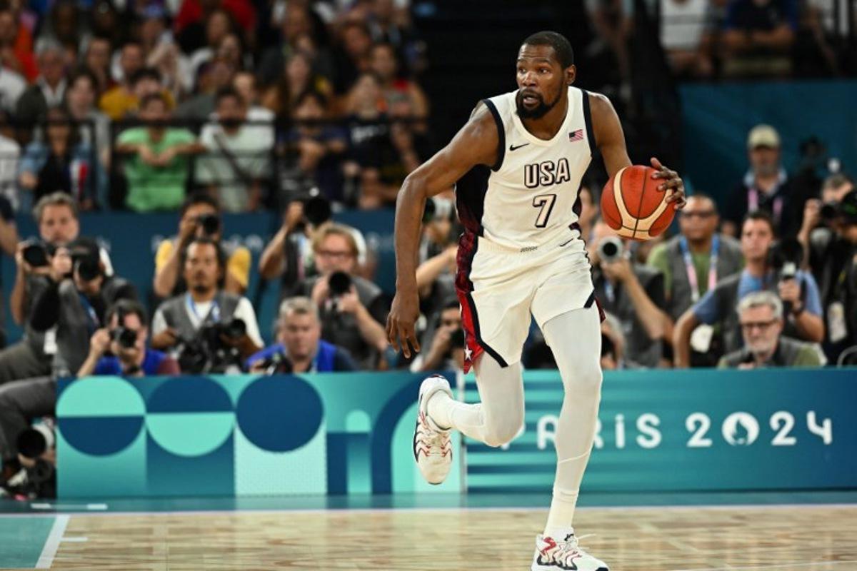 USA's #07 Kevin Durant controls the ball in the men's semifinal basketball match between USA and Serbia during the Paris 2024 Olympic Games at the Bercy  Arena in Paris on August 8, 2024.  Aris MESSINIS / AFP