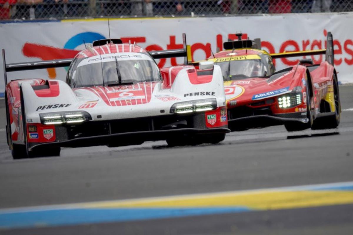 Porsche Penske Motorsport's French driver Kevin Estre steers his Porsche 963 (L) ahead of Ferrari AF Corse's Italian driver Antonio Fuoco (R) during the Le Mans 24-hours endurance race in Le Mans, western France, on June 15, 2024.  GUILLAUME SOUVANT / AFP