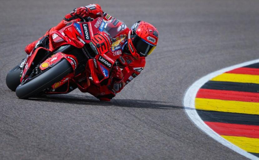 Ducati Lenovoi Team's Spanish MotoGP rider Marc Marquez steers his bike during the second practice session of the MotoGP German motorcycle Grand Prix at the Sachsenring racing circuit, in Hohenstein-Ernstthal near Chemnitz, eastern Germany on July 11, 2025.  Ronny Hartmann / AFP