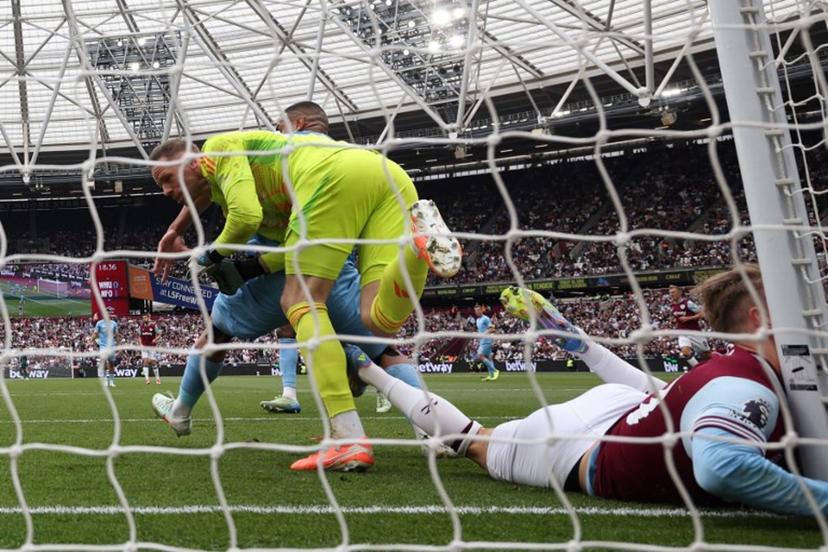 West Ham United's English striker #20 Jarrod Bowen colides with the post during the English Premier League football match between West Ham United and Nottingham Forest at the London Stadium, in London on May 18, 2025.  HENRY NICHOLLS / AFP