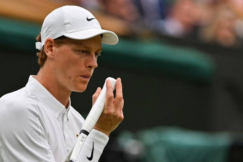 Italy's Jannik Sinner blows on his hand as he plays against Spain's Pedro Martinez during their men's singles third round tennis match on the sixth day of the 2025 Wimbledon Championships at The All England Lawn Tennis and Croquet Club in Wimbledon, southwest London, on July 5, 2025.  Glyn KIRK / AFP