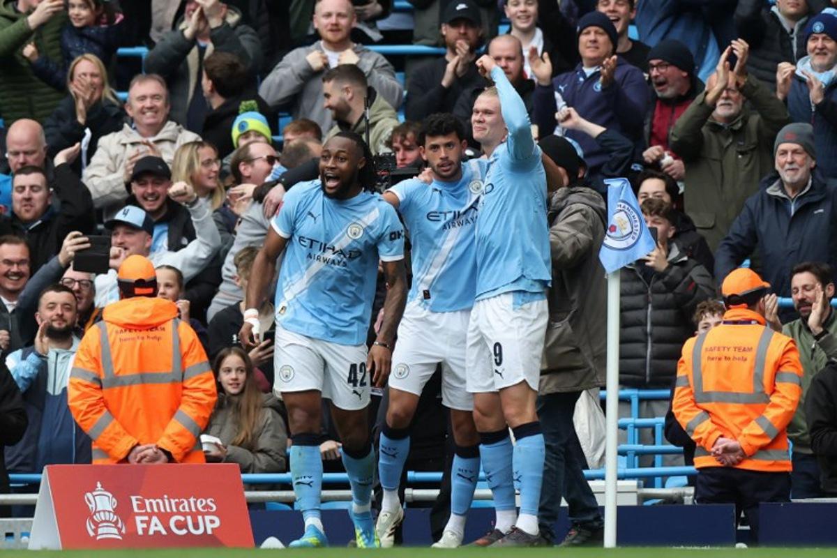Manchester City's Norwegian striker #09 Erling Haaland (R) celebrates with teammates after scoring their second goal during the English FA Cup quarter final football match between Manchester City and Liverpool at the Etihad Stadium in Manchester, north west England, on April 4, 2026.  Darren Staples / AFP