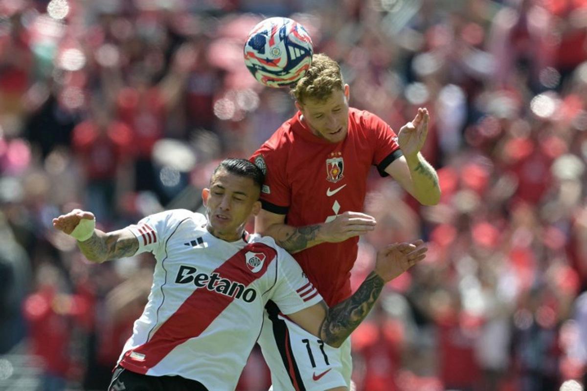 River Plate's Colombian midfielder #22 Kevin Castano and Urawa Red Diamonds' Swedish midfielder #11 Samuel Gustafson fight for the ball during the FIFA Club World Cup 2025 Group E football match between Argentina's River Plate and Japan's Urawa Red Diamonds at the Lumen Field stadium in Seattle on June 17, 2025.  JUAN MABROMATA / AFP