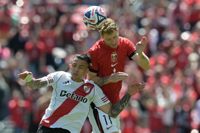 River Plate's Colombian midfielder #22 Kevin Castano and Urawa Red Diamonds' Swedish midfielder #11 Samuel Gustafson fight for the ball during the FIFA Club World Cup 2025 Group E football match between Argentina's River Plate and Japan's Urawa Red Diamonds at the Lumen Field stadium in Seattle on June 17, 2025.  JUAN MABROMATA / AFP