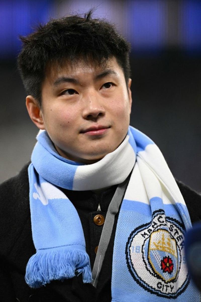 Chinese snooker player Zhao Xintong poses ahead of the UEFA Champions League league-stage football match between Manchester City and Bayer Leverkusen at the Etihad Stadium in Manchester, north west England, on November 25, 2025.  Oli SCARFF / AFP