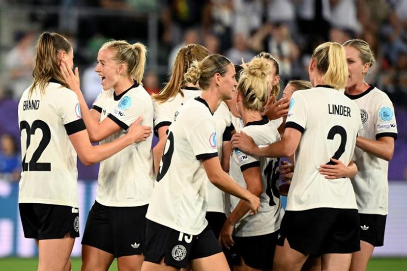 Germany's forward #11 Lea Schueller (2nd L) celebrate with teammates after scoring the team's second goal during the UEFA Women's Euro 2025 Group C football match between Germany and Poland at the Arena St.Gallen in St.Gallen on July 4, 2025.  SEBASTIEN BOZON / AFP