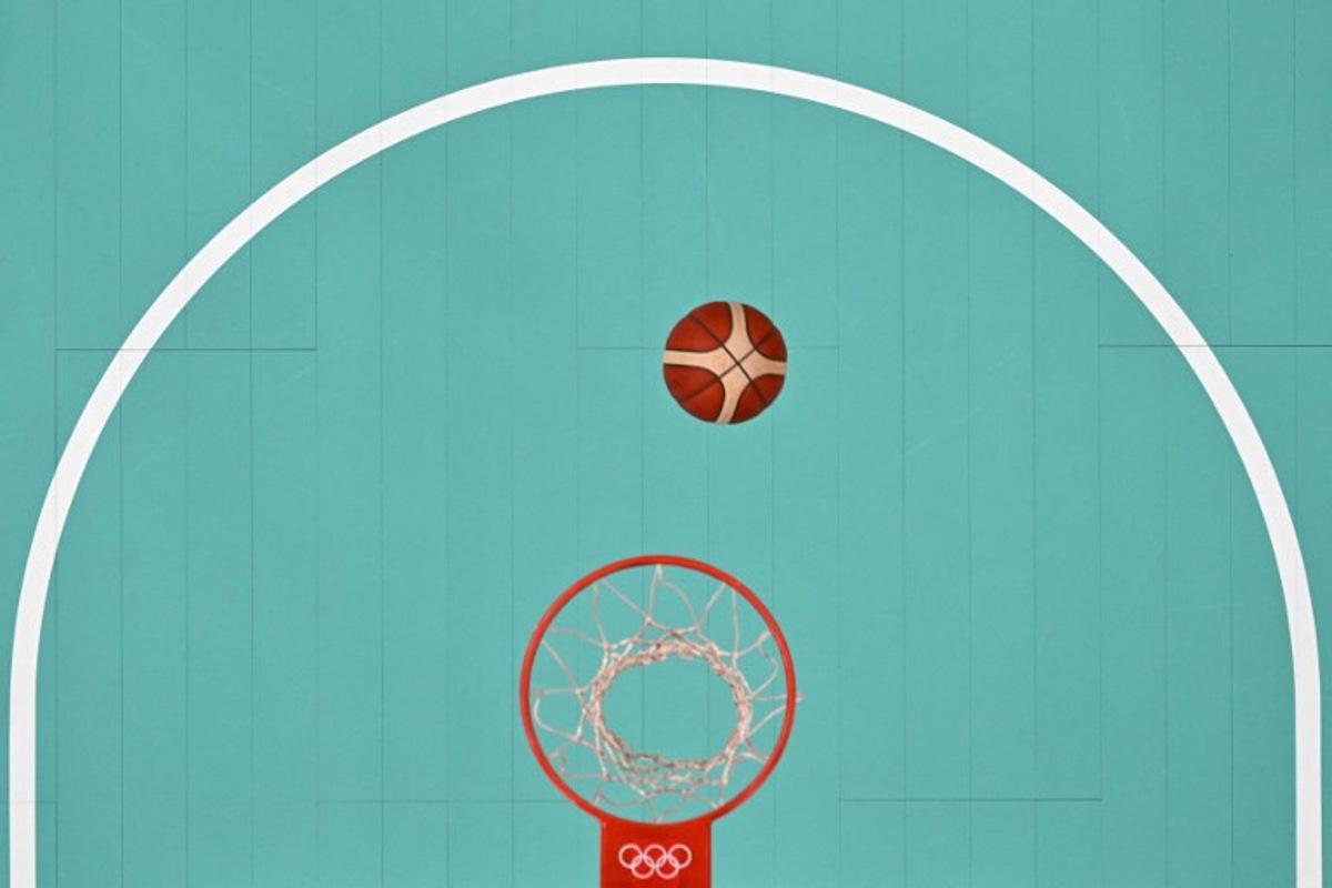 An overview shows the ball rebound in the women's preliminary round group A basketball match between Spain and China during the Paris 2024 Olympic Games at the Pierre-Mauroy stadium in Villeneuve-d'Ascq, northern France, on July 28, 2024.  Sameer Al-DOUMY / POOL / AFP
