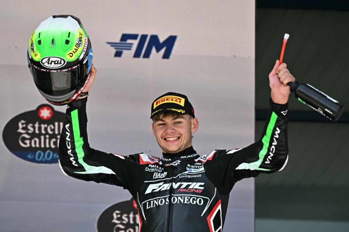 Second placed Fantic Racing's Belgian rider Barry Baltus celebrates on the podium after the Spanish Moto2 Grand Prix at the Jerez racetrack in Jerez de la Frontera, on April 27, 2025.  JAVIER SORIANO / AFP