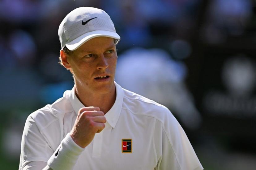 Italy's Jannik Sinner celebrates winning the second set against Serbia's Novak Djokovic during their men's singles semi-final tennis match on the twelfth day of the 2025 Wimbledon Championships at The All England Lawn Tennis and Croquet Club in Wimbledon, southwest London, on July 11, 2025.  Glyn KIRK / AFP